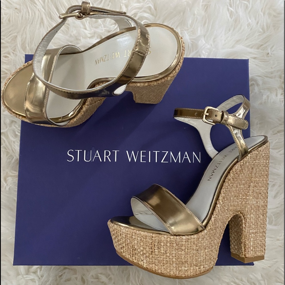 Stuart Weitzman gold platform sandal.